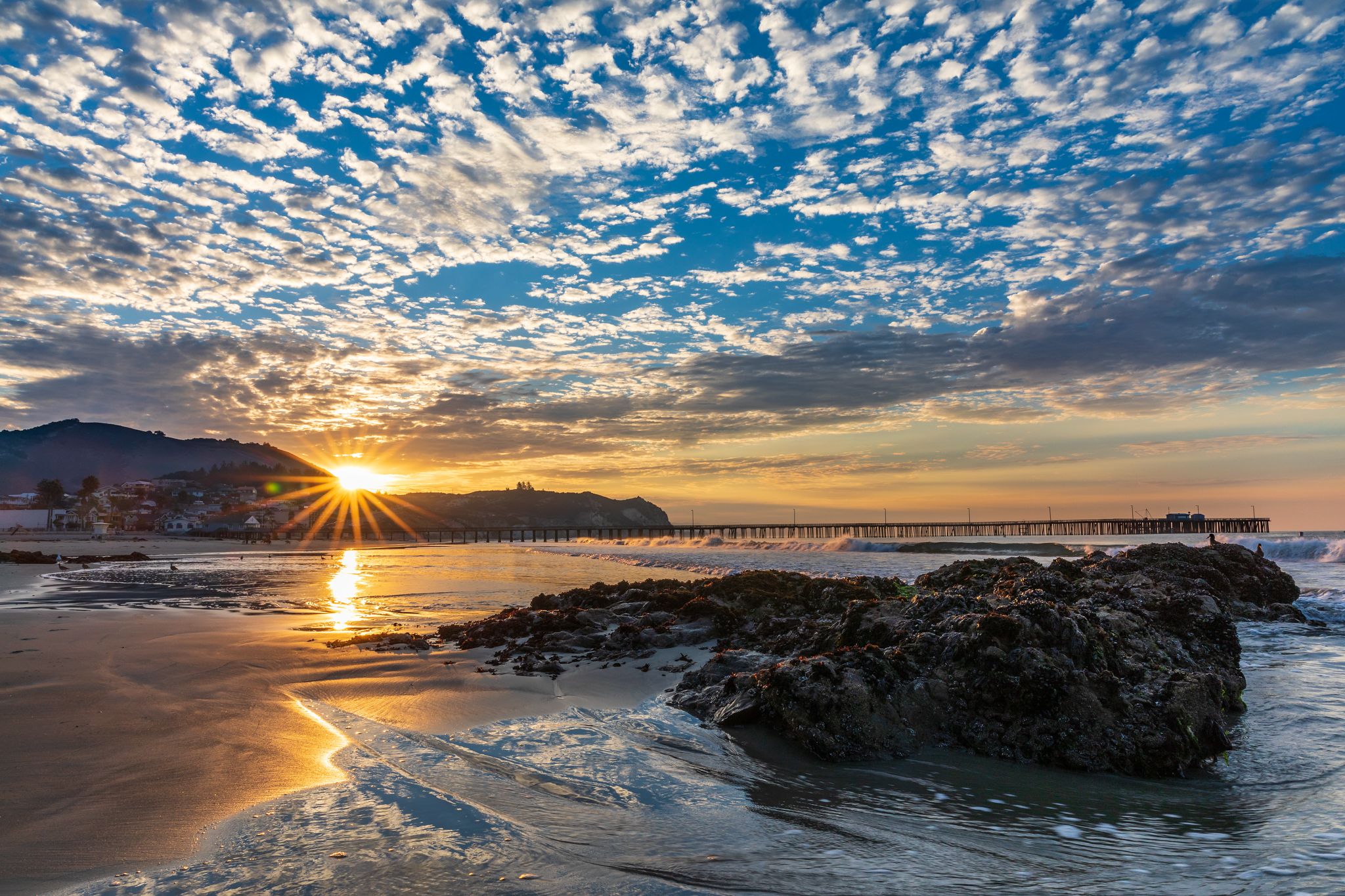 The sun bursting over Avila Pier at sunrise